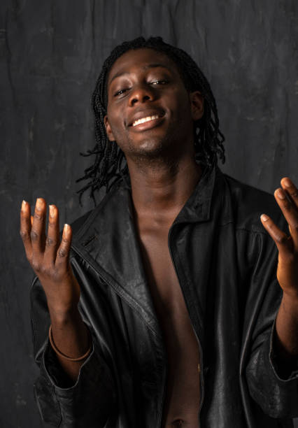 istock Young African man from Sierra Leone dressed to party. 1000482918
