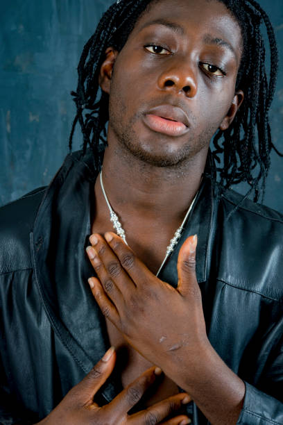 istock Young African man from Sierra Leone hand on heart. 1000489058