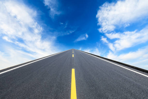 istock Asphalt road and beautiful sky clouds landscape 1000497992
