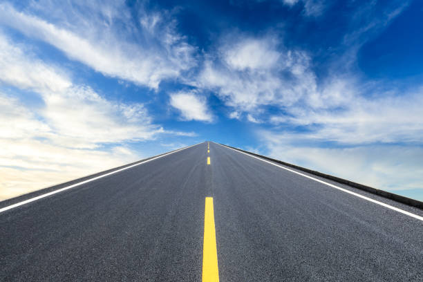 istock Asphalt road and beautiful sky clouds landscape 1000500680