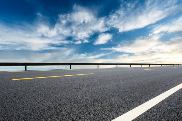 istock Asphalt road and beautiful sky clouds landscape 1000501154