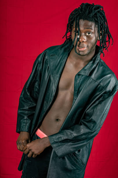 istock Young African man from Sierra Leone dressed to party. 1000505776