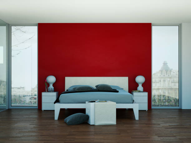 istock modern bedroom with red wall and modern decor 1000508442