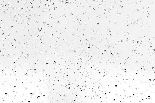 istock Texture water drops or raindrop on glass of car. 1000536472