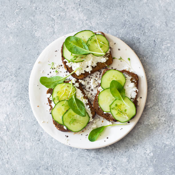 istock Healthy open sandwichis with fresh vegetables and soft cheese 1000540110