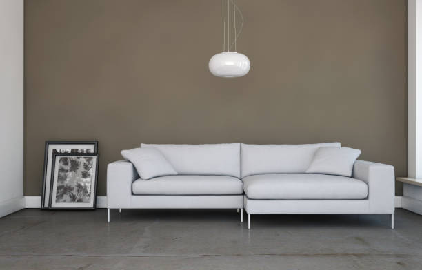 istock Bright room with white sofa in front of a brown wall 1000557340
