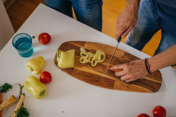 istock Young vegan couple preparing meals in the kitchen 1000560370