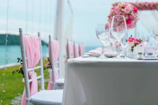 istock Table setting at a luxury wedding and Beautiful flowers on the table. 1000564392