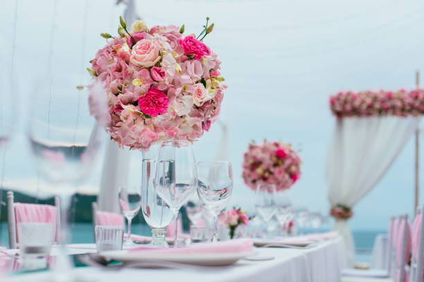 istock Table setting at a luxury wedding and Beautiful flowers on the table. 1000564422