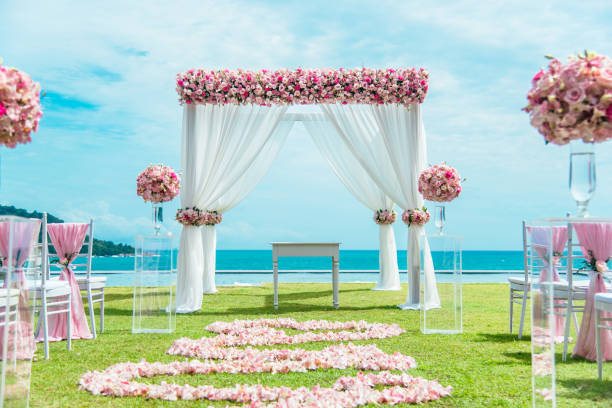 istock Romantic wedding ceremony on the lawn Sea view. 1000564672