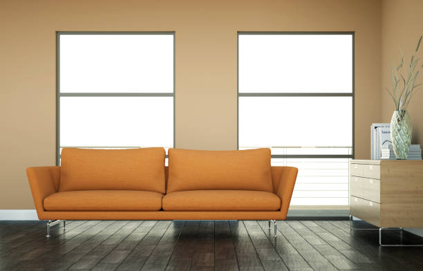 istock Bright room with orange sofa in front of a brown wall 1000591024