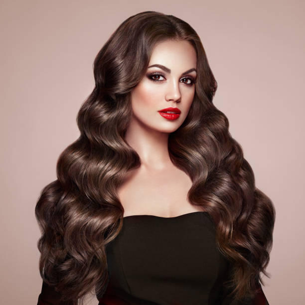 istock Brunette woman with curly hair 1000591192