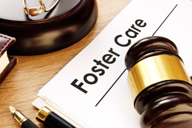 istock Foster care. Documents and gavel on a desk. 1000655518