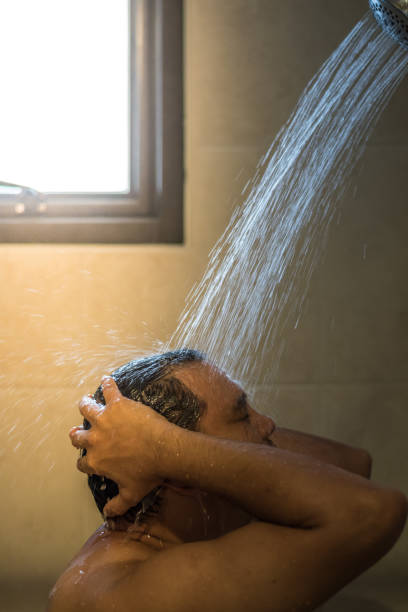 istock Asian man shower in bathroom for clean a body 1000656466