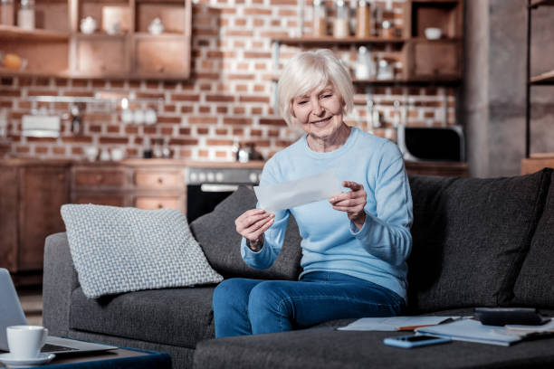 istock Pleased senior woman looking at counting 1000673484