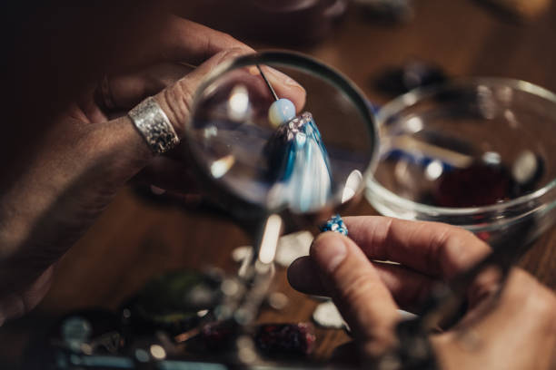 istock Woman making beautiful jewelry 1000673772