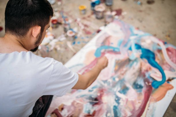 istock Artist-painter working on painting outdoors 1000677510