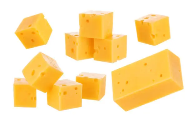 Heap of cheese cubes isolated on a white background. With clipping path.