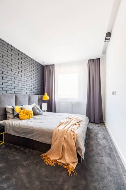 istock Yellow and grey bedroom interior 1000697664