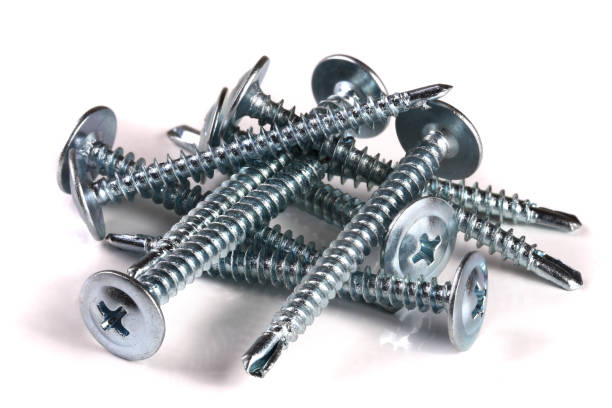 istock metal screws isolated on white background closeup 1000698110