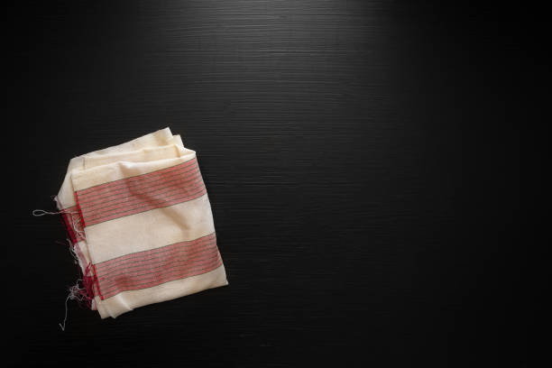 istock Red napkin on dark wooden table. Copy space 1000709614