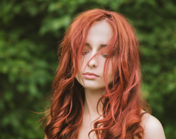 istock Red haired woman with blue eyes. 1000716296