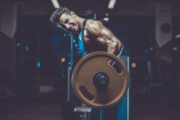 istock Handsome model young man workout in gym 1000716620