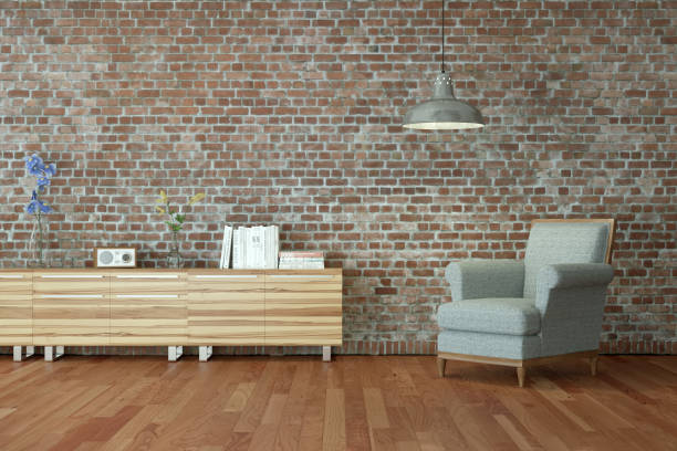 istock Bright room with grey chair in front of a stonewall 1000719440