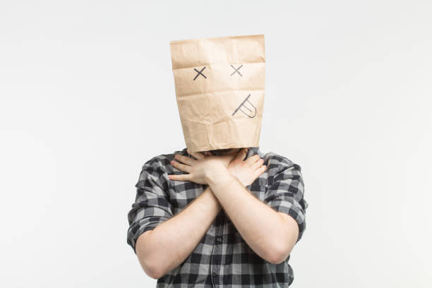 men in dead paper bag mask strangle himself Closeup portrait of men in dead paper bag mask strangle himself woman strangles man stock pictures, royalty-free photos & images