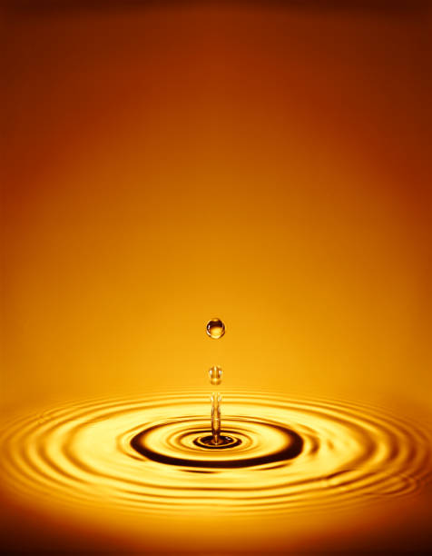 istock WATER DROPLETS WITH RIPPLES IN LIQUID 1000734756