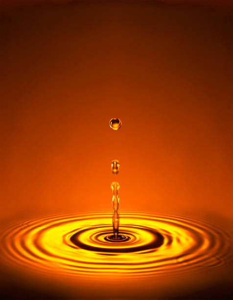 istock WATER DROPLETS WITH RIPPLES IN LIQUID 1000735238