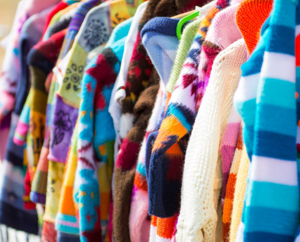 istock Knitwear hanging on rail for sale 1000742186