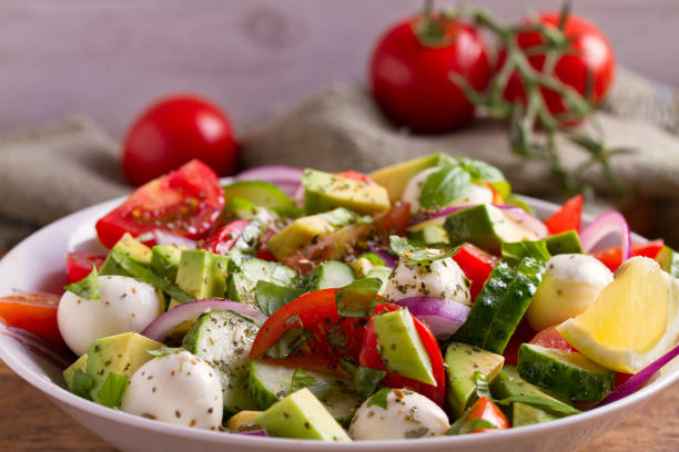 istock Avocado, tomato, cucumber salad with mozzarella cheese 1000746764