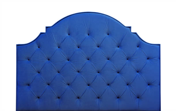 istock Blue velvet bed headboard isolated on white 1000755640