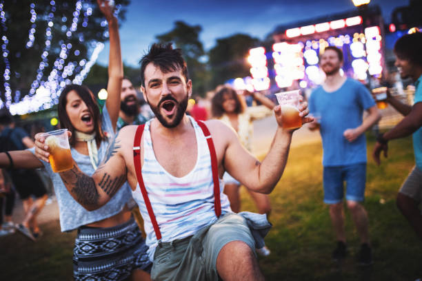 istock Friends dancing at a concert. 1000755950
