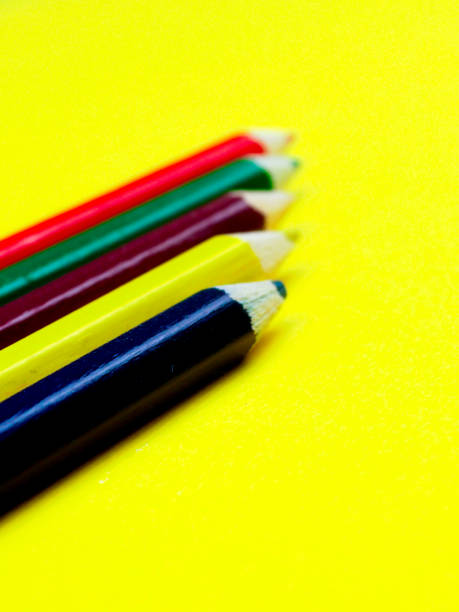 istock colored pencils on a yellow background, space for text 1000759158