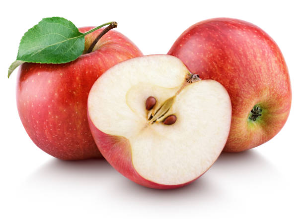 istock Ripe red apples with half and apple leaf isolated on white 1000760872