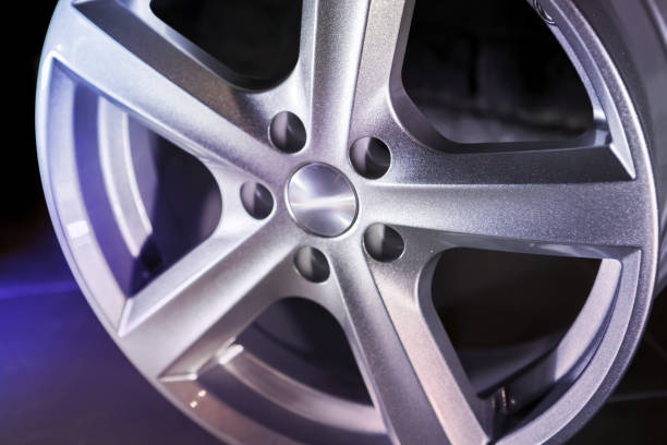 istock alloy wheel on dark background 1000763960