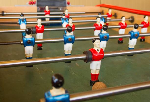 istock Foosball, also known as table soccer, with red and blue players 1000770170
