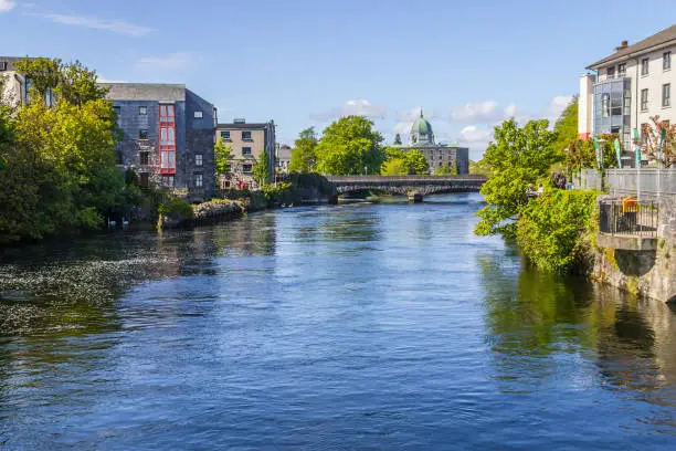 Corrib river with Galway Cathedral in background, Galway, Ireland