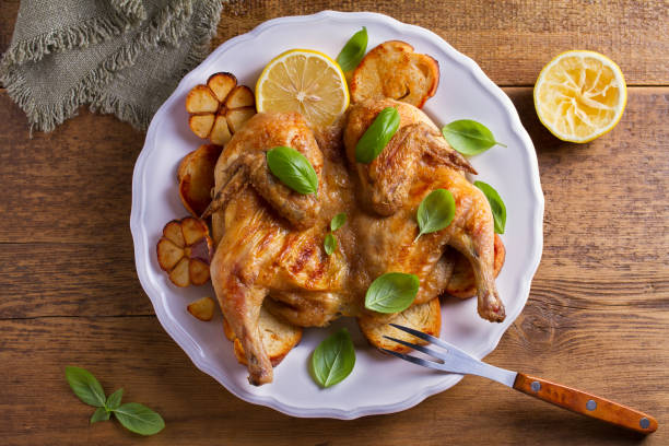 istock Spatchcock chicken on bread with lemon, basil and garlic 1000783784