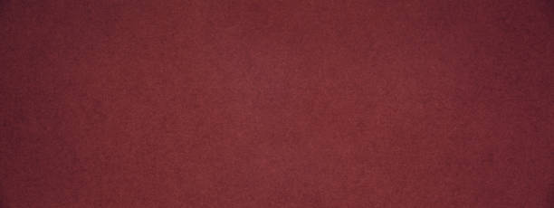 istock Trendy red pear color textured paper background 1000789702