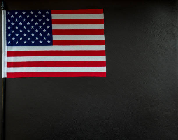 istock little american flag on dark leather surface with space for text 1000791890