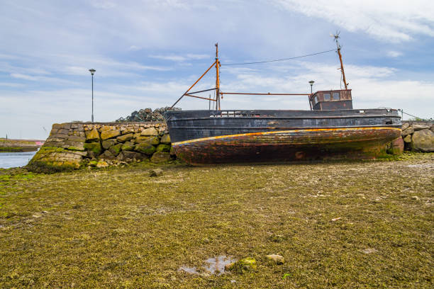 istock Pier with stuck boat in Corrib river 1000795892