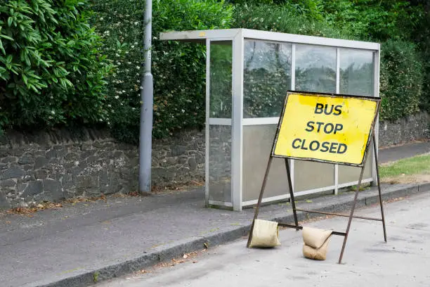 Bus stop closed sign road works no public transport cancelled emergency repair uk