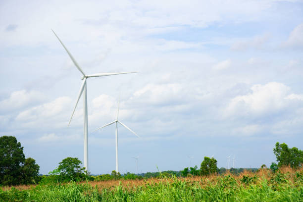 istock Wind turbines generating electricity on  blue sky background .Eco power 1000815290