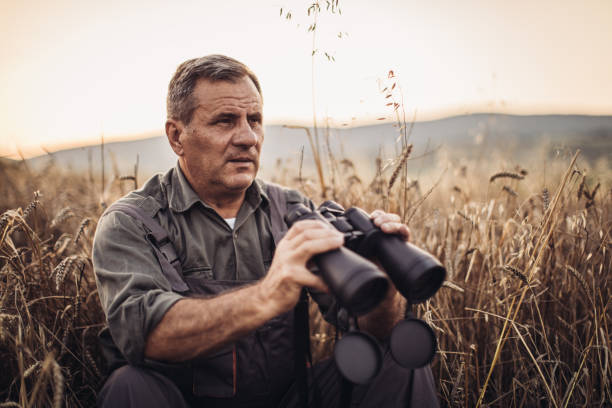 istock Farmer in a field examining crop 1000818324
