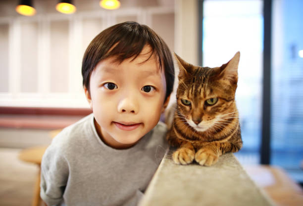 istock Cute children and cat 1000823888