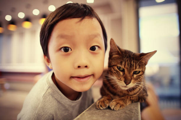 istock Cute children and cat 1000823898