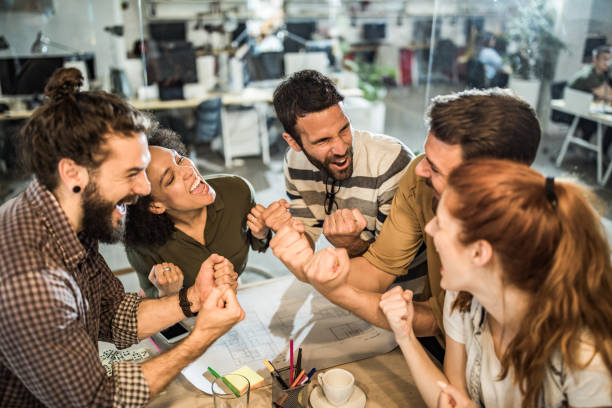 istock Celebrating good news in the office! 1000824258